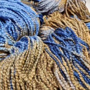A skein of yarn with blue and brown colors.
