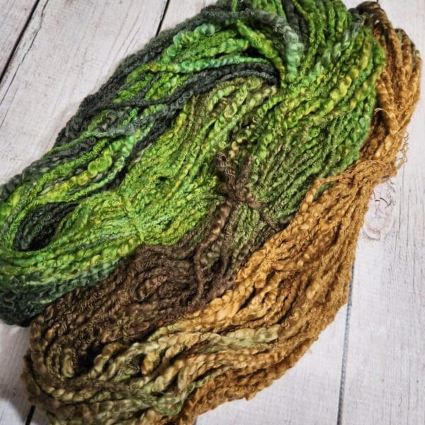 A skein of yarn with green and brown colors.
