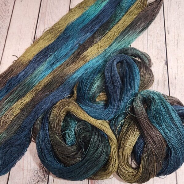 A skein of blue, green, and brown yarn.