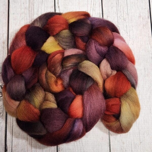 A skein of roving in a variety of colors.