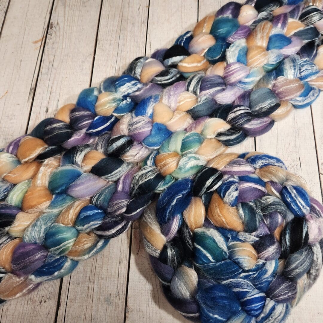 A skein of yarn with blue and purple colors.