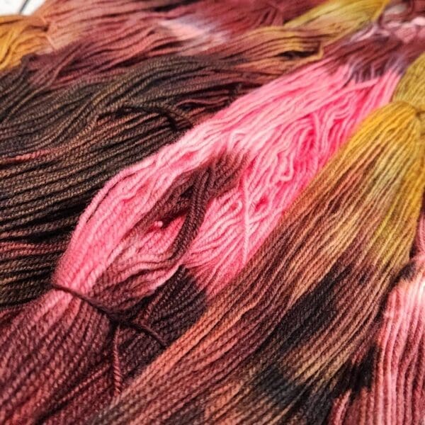 A close up of a bunch of dyed skeins.