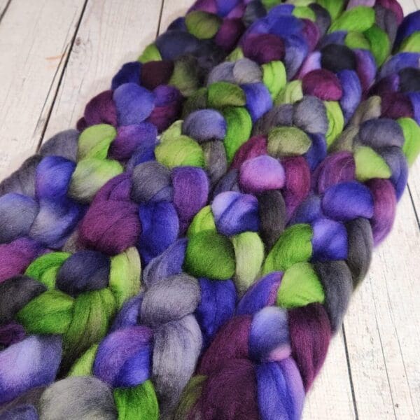 Purple, green, and blue wool roving.