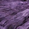 A close up of a purple skein of yarn.