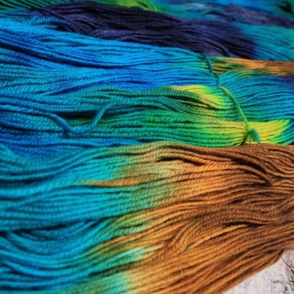 Skeins of dyed yarn on a table.