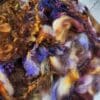 Purple, brown, and gold wool fibers.