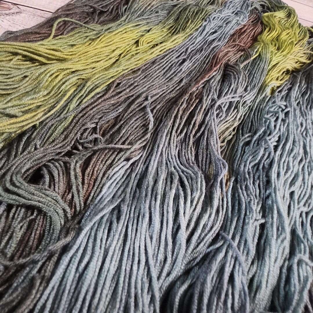 Variegated gray and yellow yarn skeins