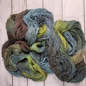 Earthy green and teal hand-dyed yarn skeins