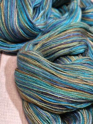 Variegated teal, blue, and olive yarn