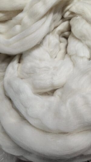 Soft undyed merino wool roving folds