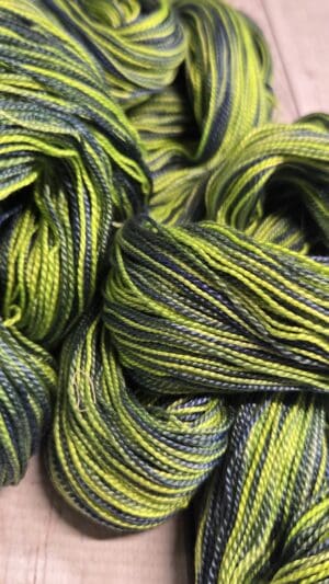 Lime and dark green twisted yarn skeins