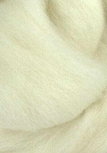 A close up of a white roving, part of Fresh Lotus Design's Fiber Facts collection.
